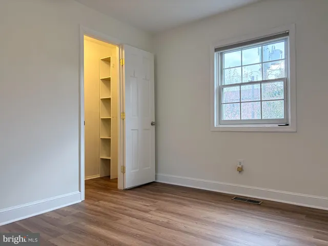 a view of a backyard with wooden fence