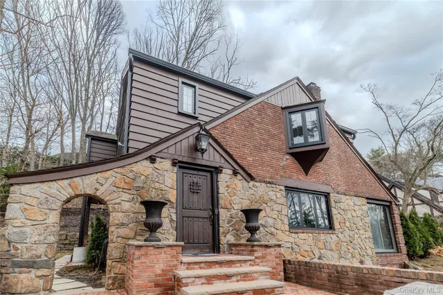 a front view of a house with wooden stairs