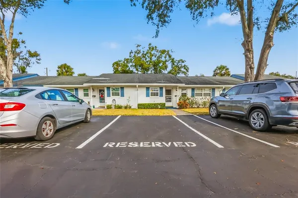 a view of a car parked in front of a house