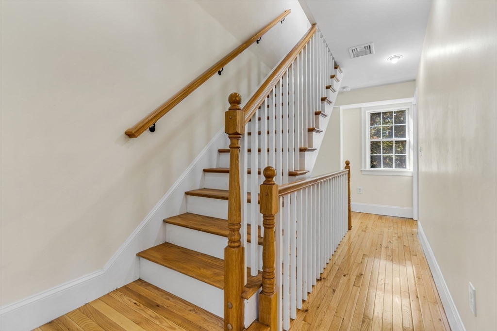 37 Water Street, Unit 37 Concord, MA 01742 - Photo 22 of 29 a view of entryway with wooden floor and stairs