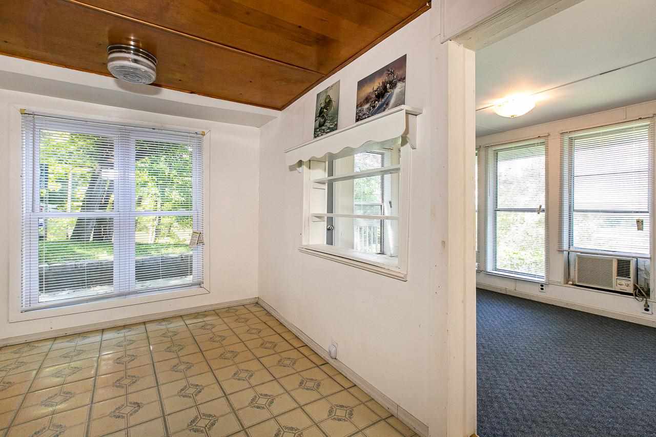 4798 South River Road Hanover, IL 61041 - Photo 13 of 14 a view of an entryway with wooden floor and windows