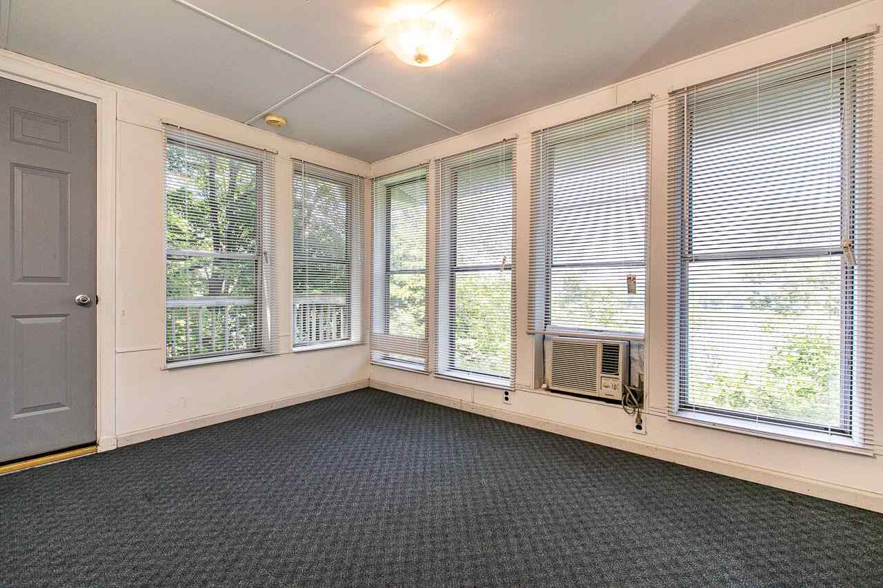 4798 South River Road Hanover, IL 61041 - Photo 4 of 14 a view of room with balcony and furniture