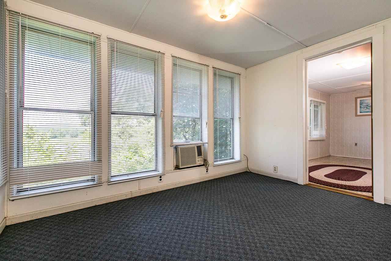 4798 South River Road Hanover, IL 61041 - Photo 5 of 14 a view of a room with large windows