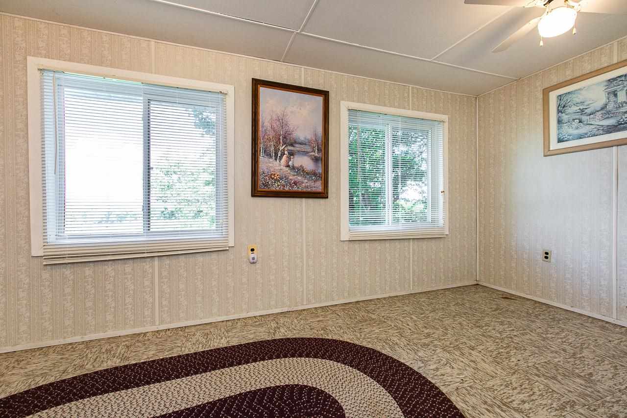 4798 South River Road Hanover, IL 61041 - Photo 8 of 14 a view of a bedroom with wooden floor and a window