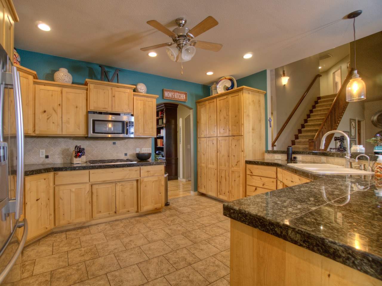 1516 13 Road Loma, CO 81524 - Photo 17 of 32 a kitchen with stainless steel appliances granite countertop a sink a stove and a refrigerator