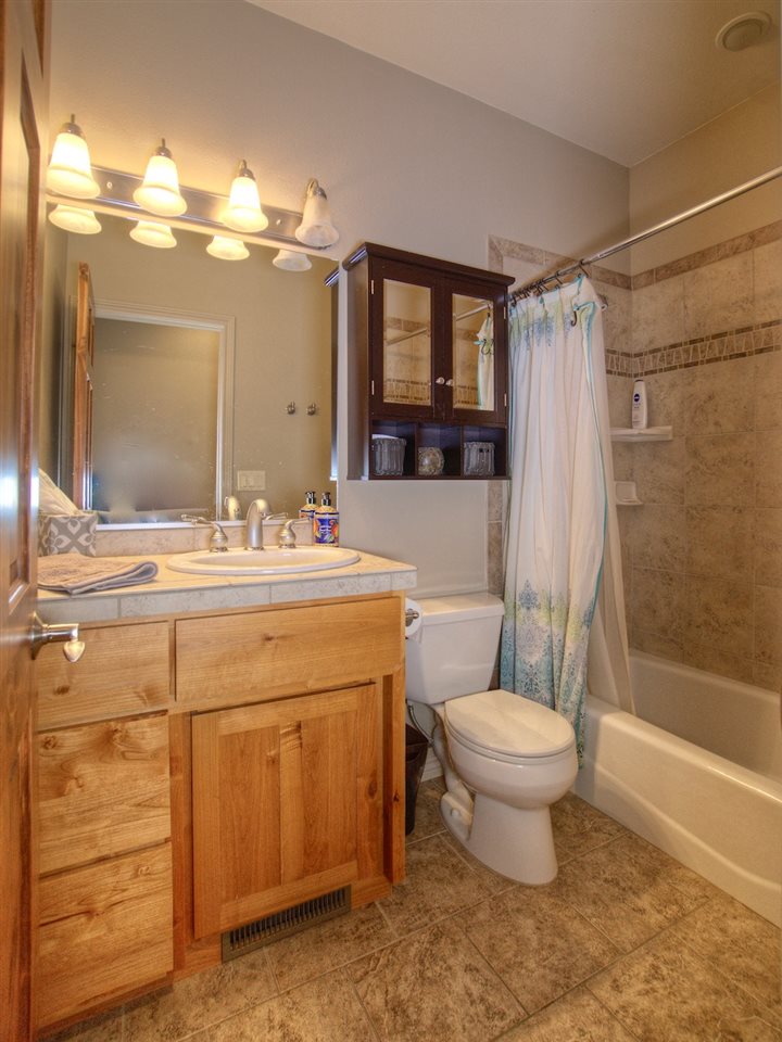 1516 13 Road Loma, CO 81524 - Photo 23 of 32 a bathroom with a double vanity sink toilet mirror and shower