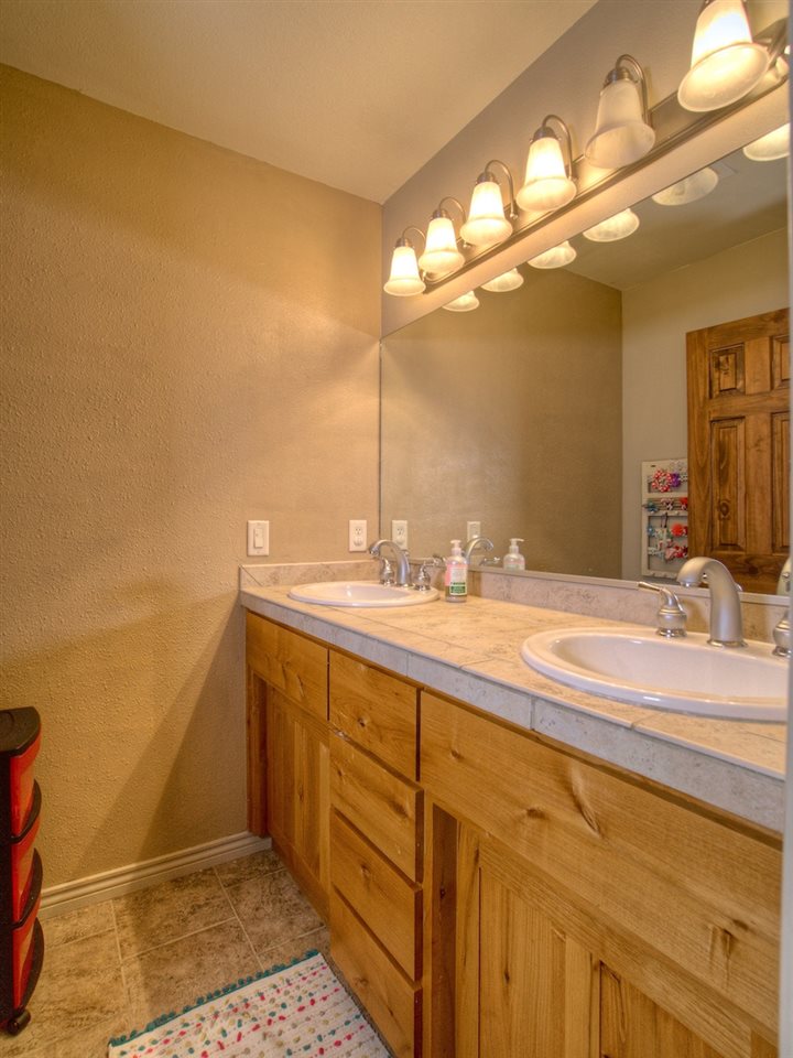 1516 13 Road Loma, CO 81524 - Photo 26 of 32 a bathroom with a sink and a mirror