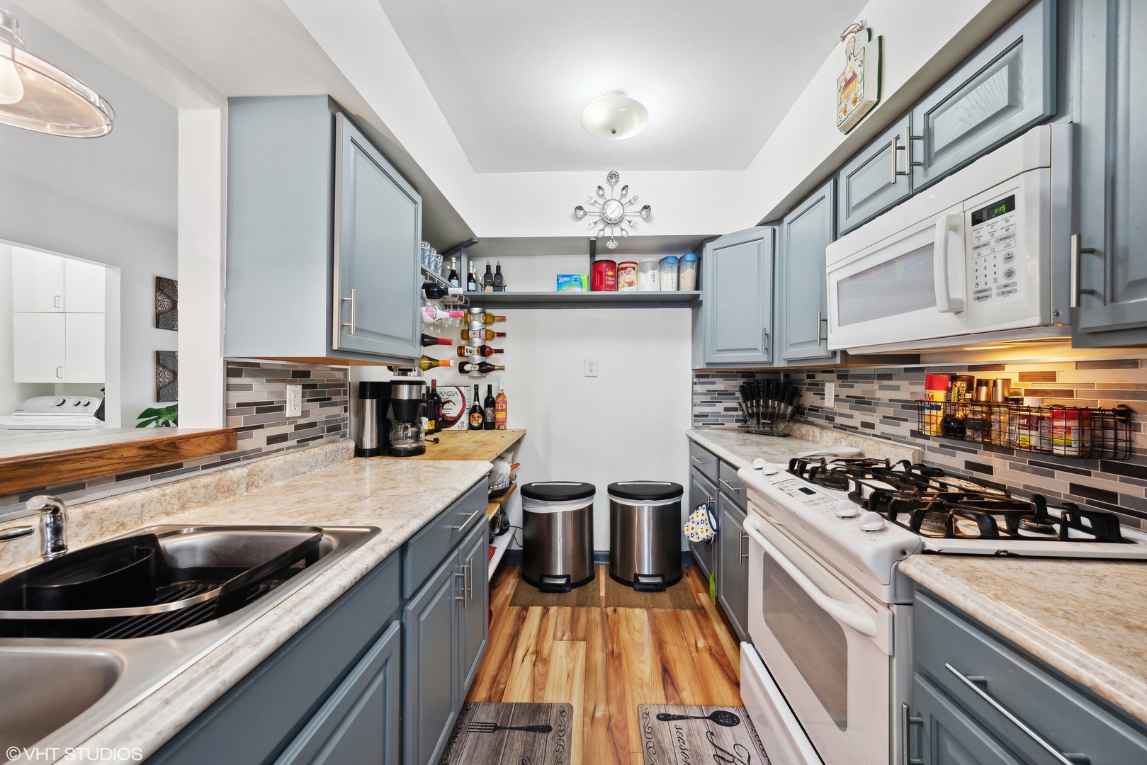 171 Seabury Road Bolingbrook, IL 60440 - Photo 5 of 13 a kitchen with kitchen island a counter space a sink a stove and cabinets
