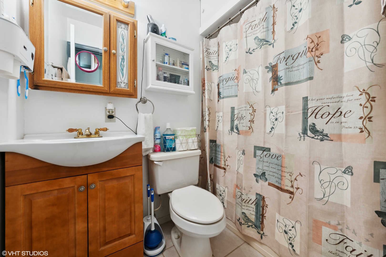171 Seabury Road Bolingbrook, IL 60440 - Photo 7 of 13 a bathroom with a sink toilet and shower