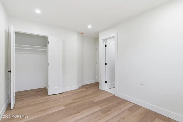 a view of a livingroom with wooden floor