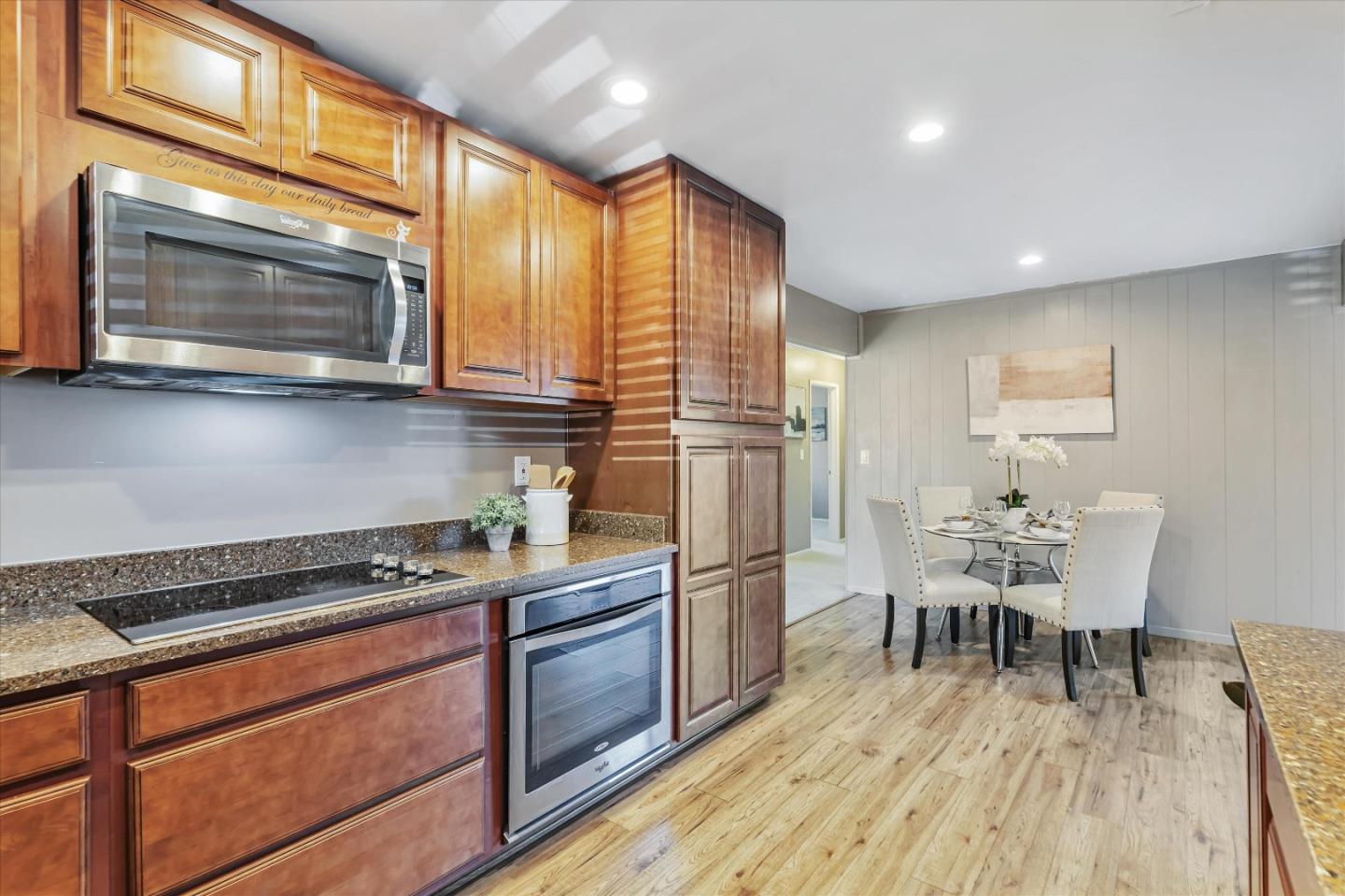 363 River View Drive San Jose, CA 95111 - Photo 16 of 41 a kitchen with stainless steel appliances a stove a sink dishwasher and a microwave