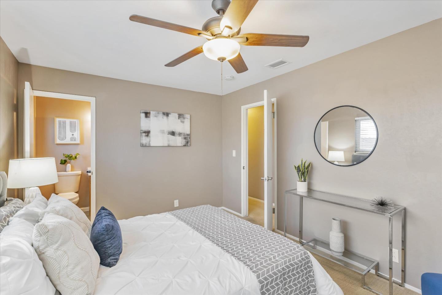 363 River View Drive San Jose, CA 95111 - Photo 27 of 41 a bedroom with a large bed and a chandelier