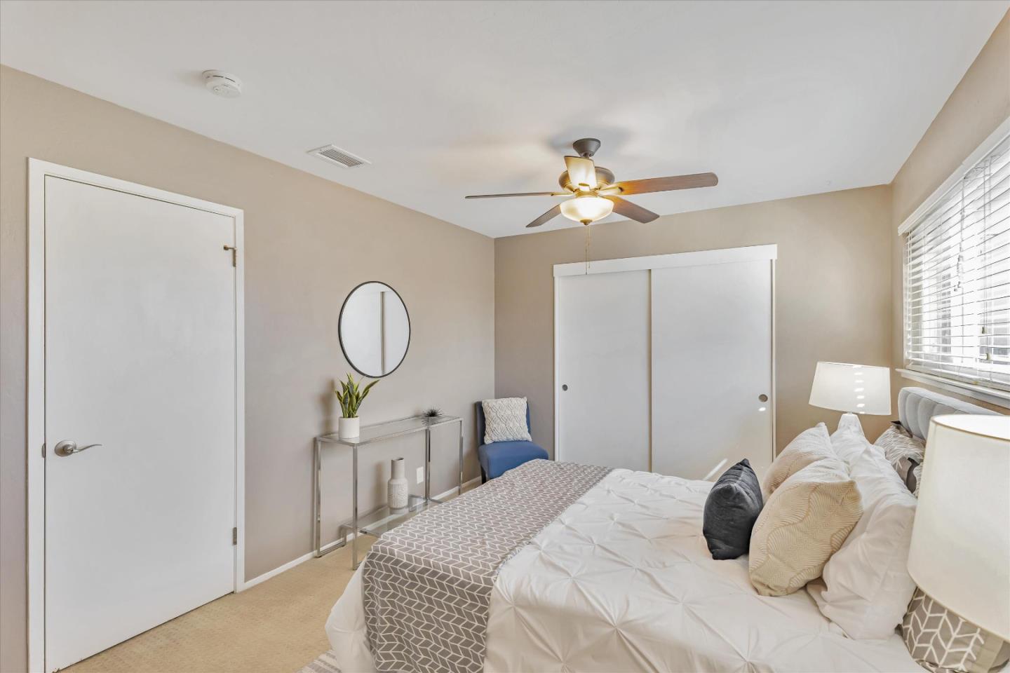 363 River View Drive San Jose, CA 95111 - Photo 28 of 41 a bedroom with a bed and a chandelier