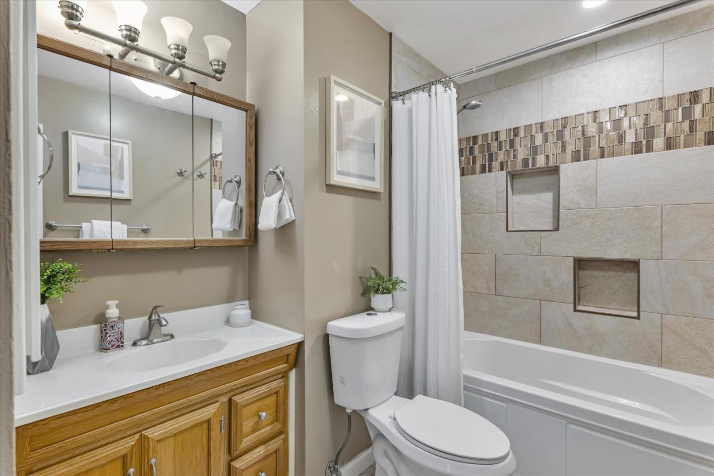 363 River View Drive San Jose, CA 95111 - Photo 30 of 41 a bathroom with a granite countertop sink toilet a mirror and shower