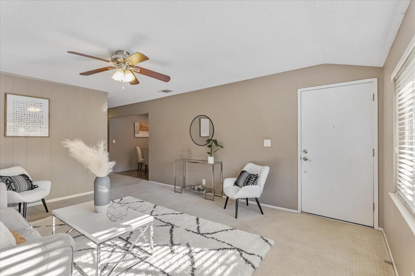 363 River View Drive San Jose, CA 95111 - Photo 8 of 41 a living room with furniture a rug and a window