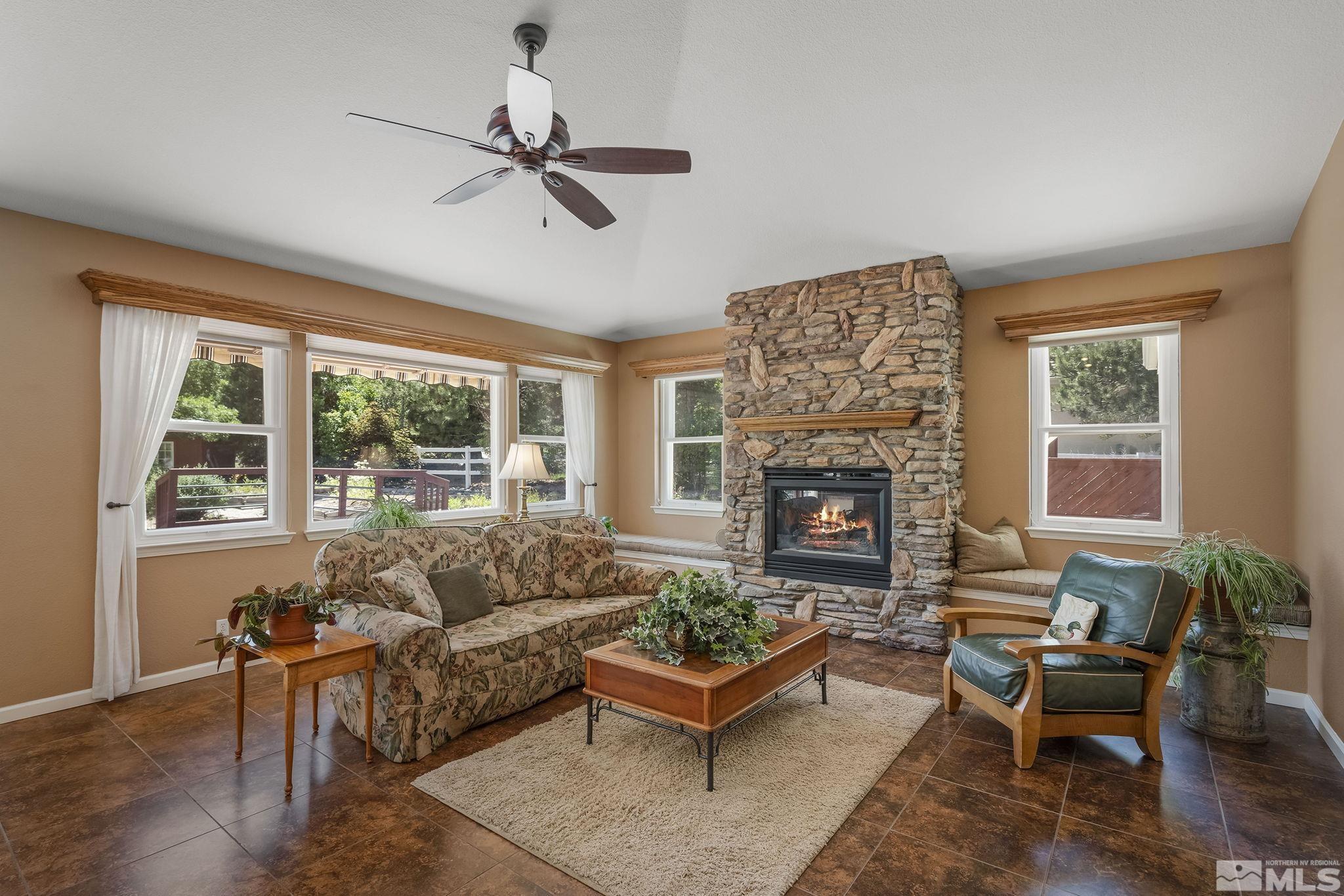 820 Flanders Road Reno, NV 89511 - Photo 15 of 40 a living room with furniture and a fireplace