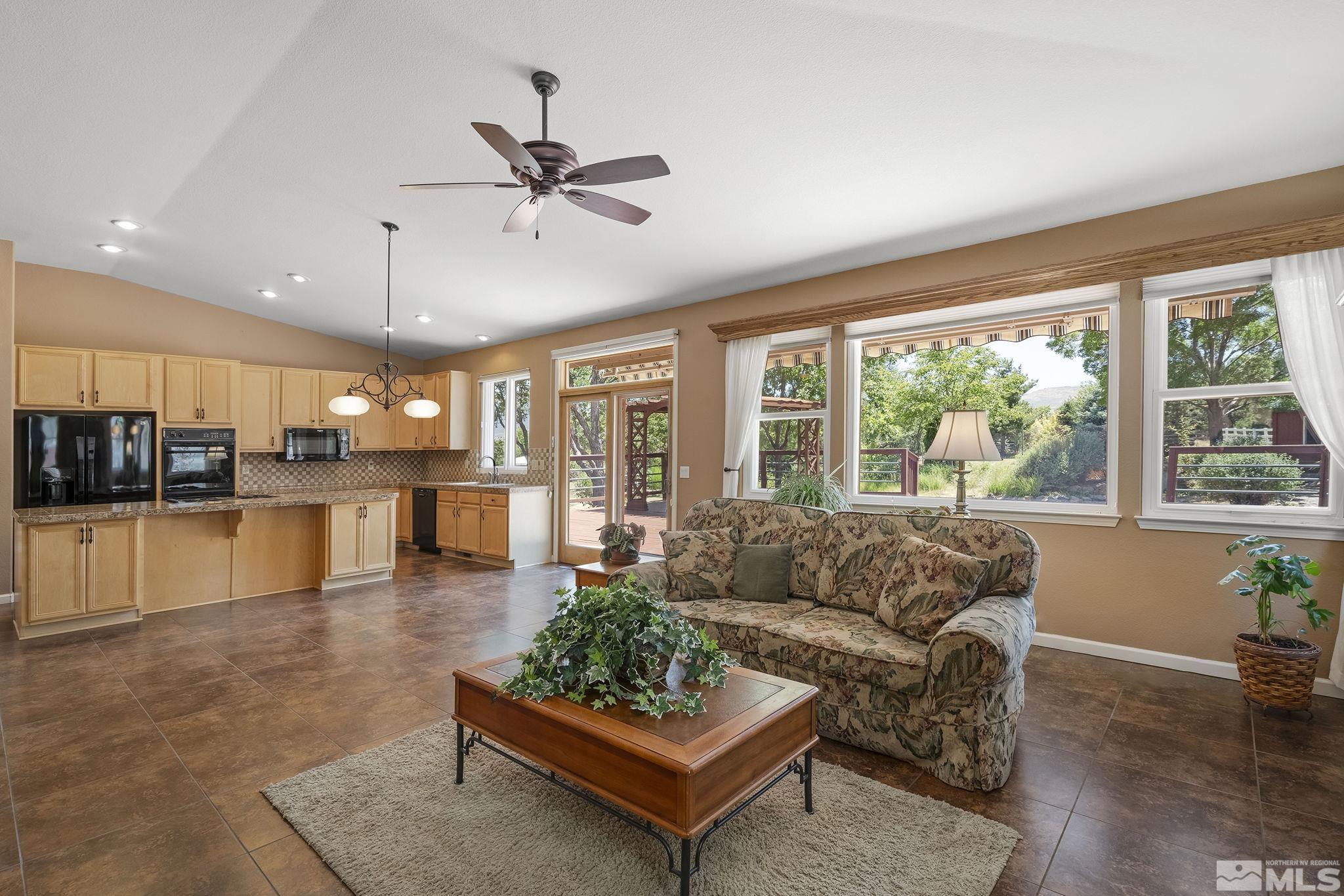 820 Flanders Road Reno, NV 89511 - Photo 16 of 40 a living room with furniture and a large window