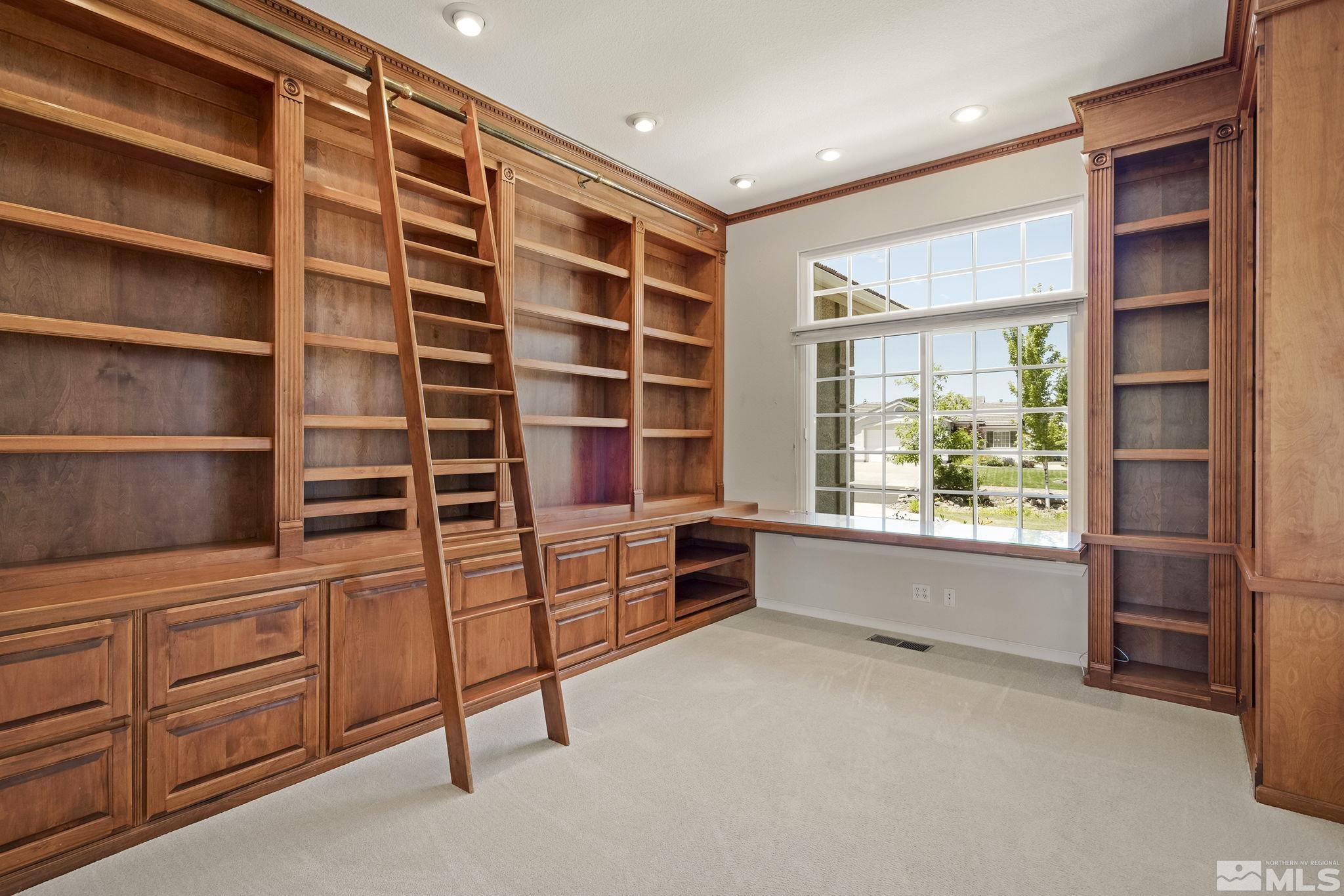820 Flanders Road Reno, NV 89511 - Photo 23 of 40 a room with furniture and a window