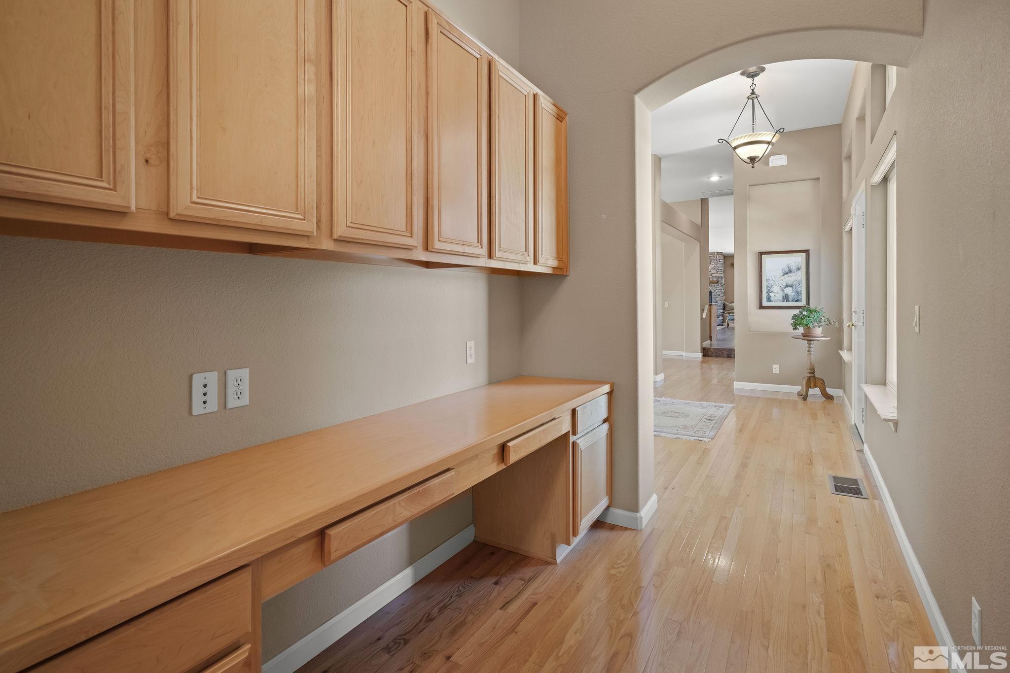 820 Flanders Road Reno, NV 89511 - Photo 24 of 40 a view of a room with wooden floor and staircase