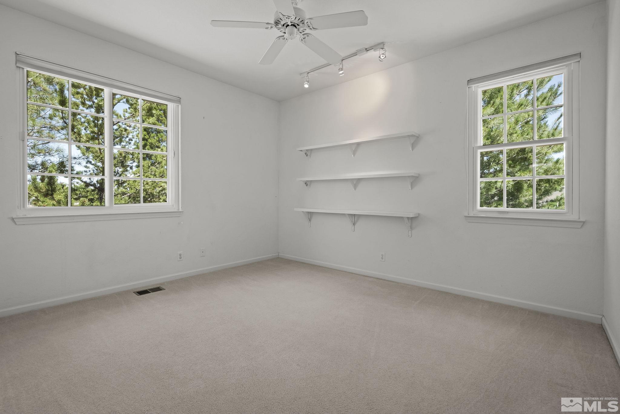 820 Flanders Road Reno, NV 89511 - Photo 25 of 40 an empty room with a empty space and windows