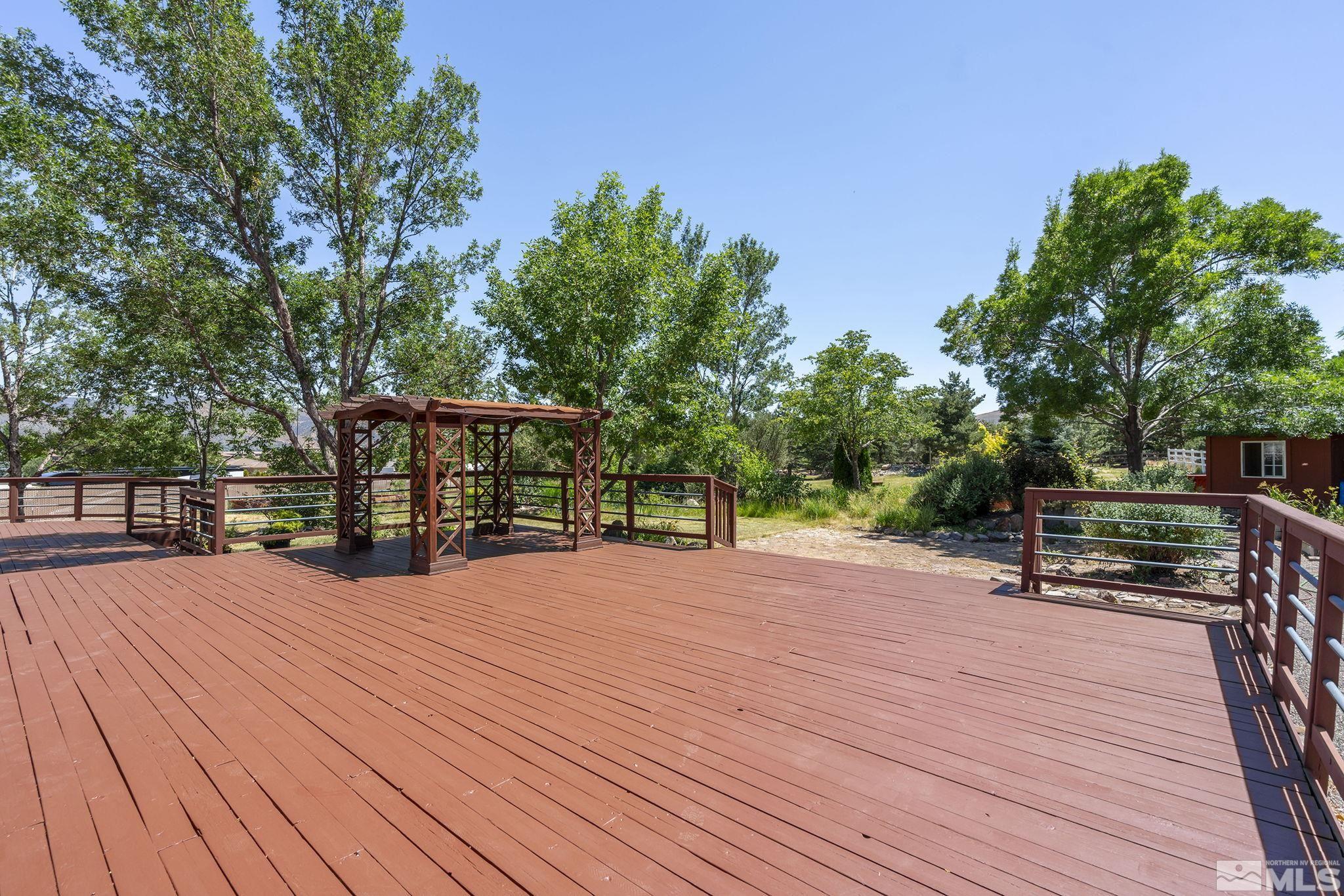 820 Flanders Road Reno, NV 89511 - Photo 34 of 40 a view of a house with pool and wooden floor