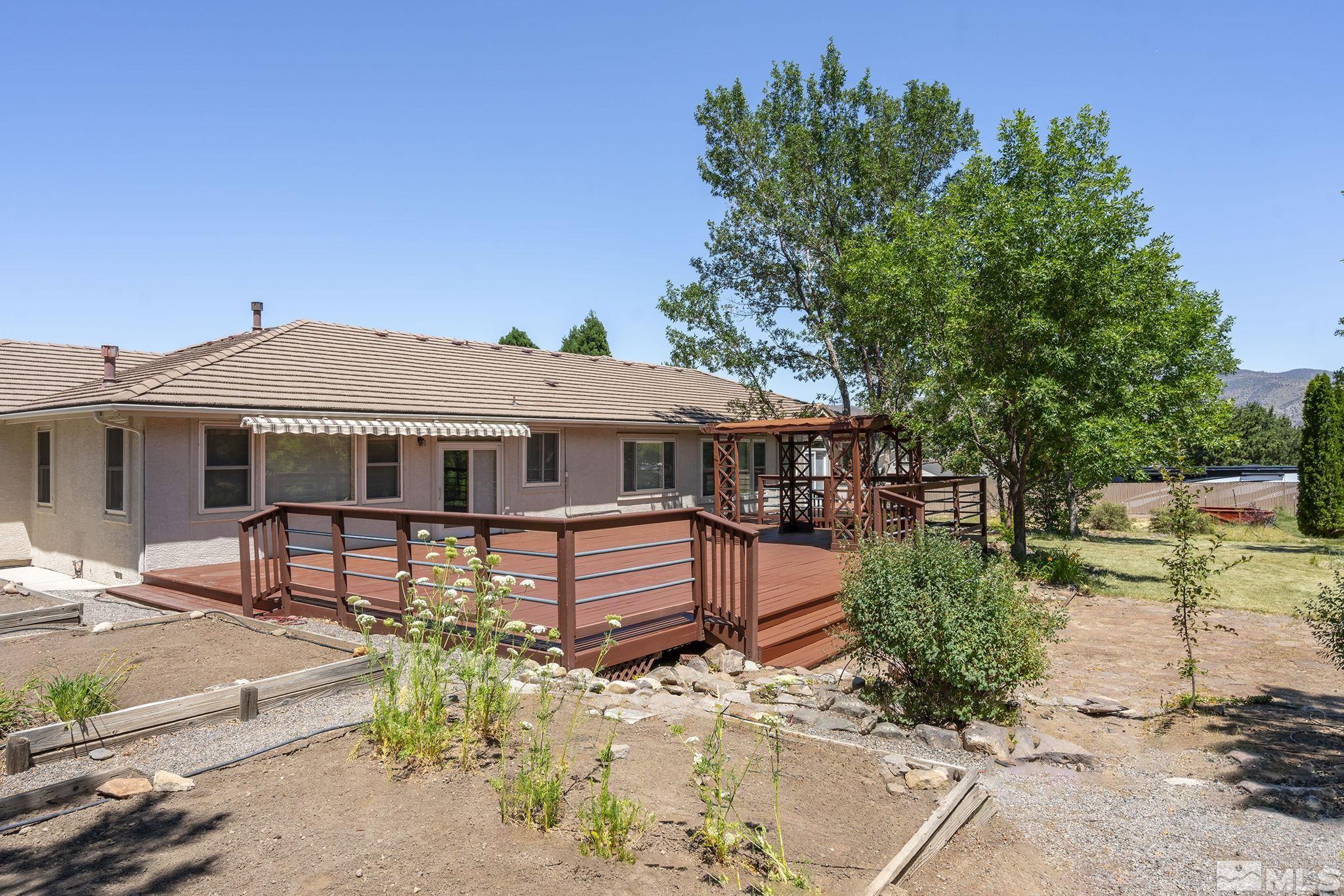 820 Flanders Road Reno, NV 89511 - Photo 37 of 40 a front view of a house with a garden