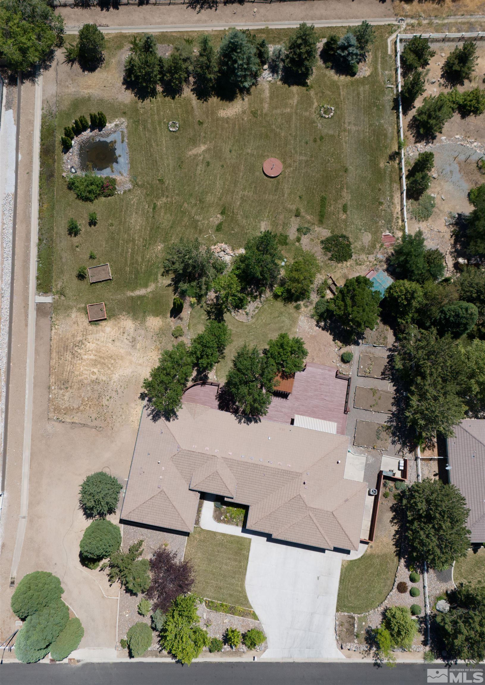 820 Flanders Road Reno, NV 89511 - Photo 40 of 40 an aerial view of a house with a yard and lake view