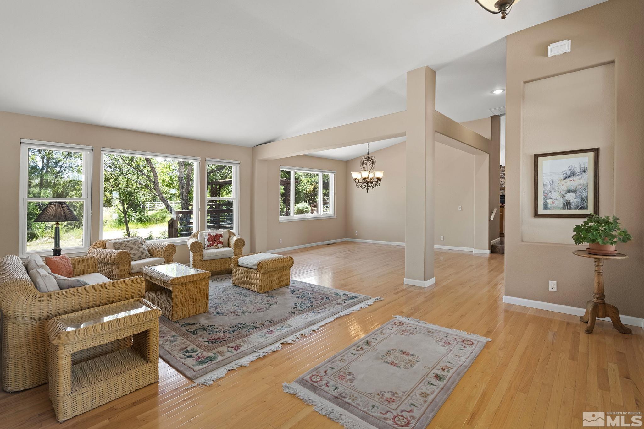 820 Flanders Road Reno, NV 89511 - Photo 5 of 40 a living room with furniture and a wooden floor