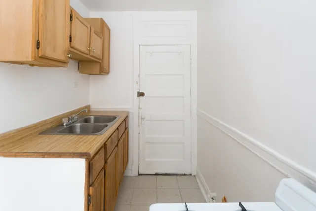 a bathroom with a sink a toilet and vanity