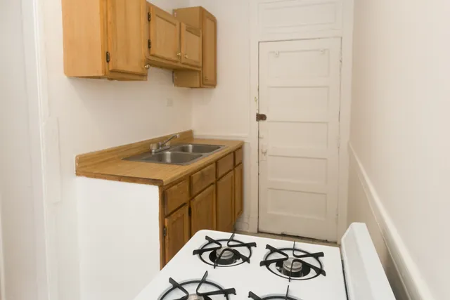 a bathroom with a sink and cabinets