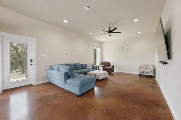 a living room with furniture and a flat screen tv