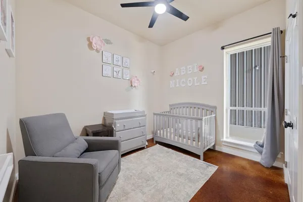 a bedroom with furniture and a window