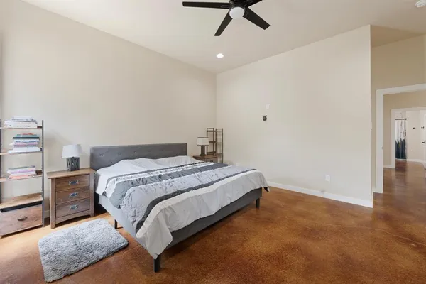 a bedroom with a bed and cabinets