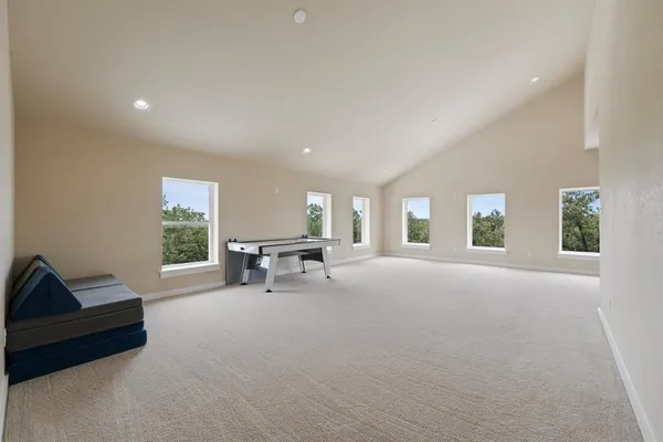 a view of a livingroom with furniture and windows