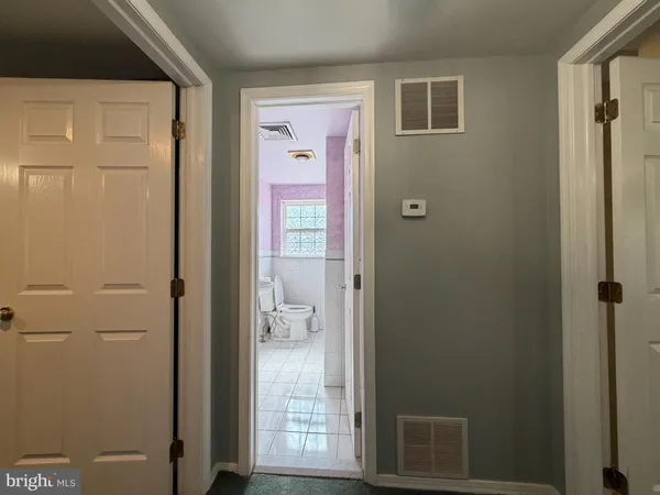 a bathroom with a shower and a sink