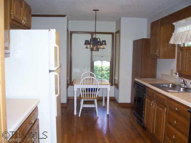 8396 Coachman Lane Rural Hall, NC 27045 - Photo 3 of 9 Other. Kitchen has beautiful hardwood floors and a breakfast nook.