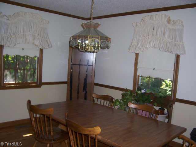 8396 Coachman Lane Rural Hall, NC 27045 - Photo 4 of 9 Other. Formal dining room also with hardwood floors.