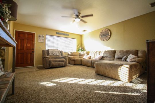 632 South Nevada Street Ridgecrest, CA 93555 - Photo 5 of 29 a living room with furniture and a large window