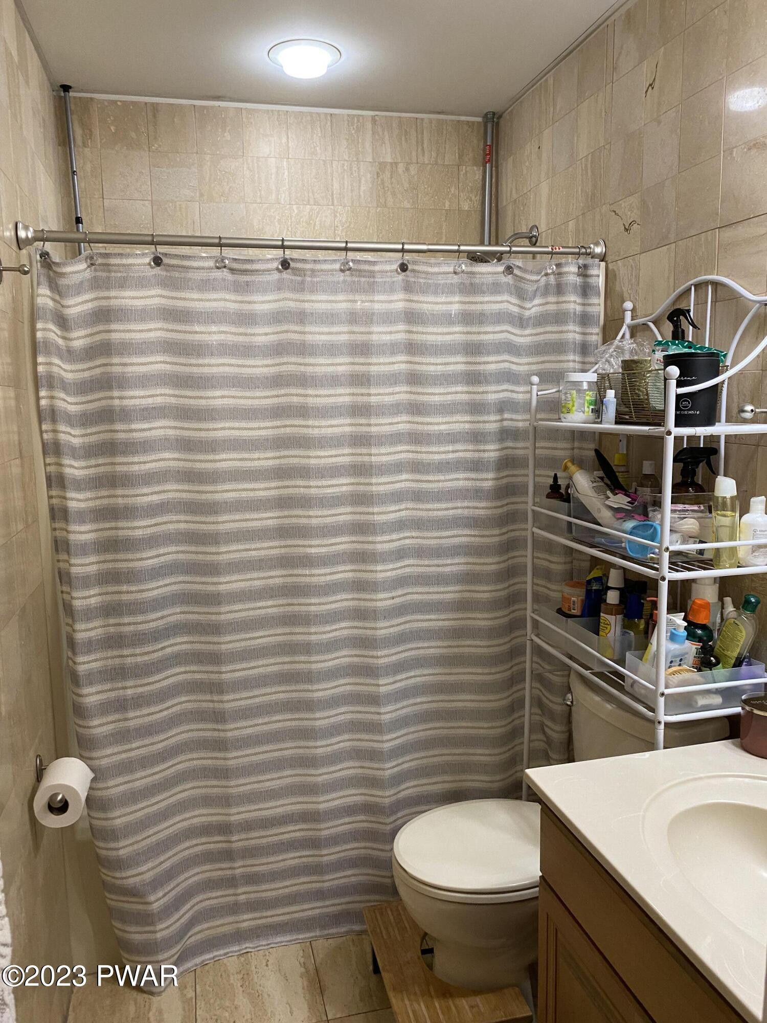 126 Maple Ridge Road Milford, PA 18337 - Photo 46 of 52 a bathroom with a sink a toilet and shower