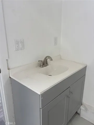 a close up of a sink and a mirror