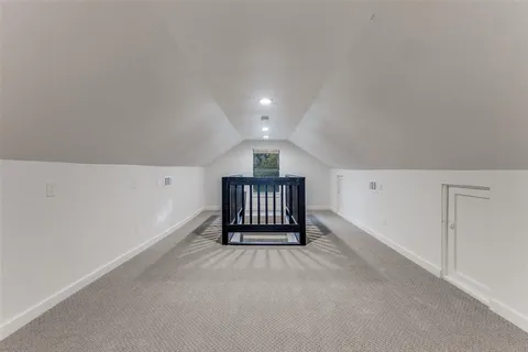 a view of an empty room and a window