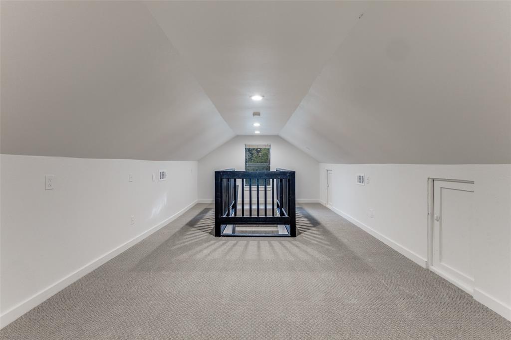 5848 Kenwood Avenue Dallas, TX 75206 - Photo 27 of 32 a view of an empty room and a window