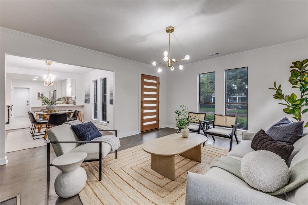 5848 Kenwood Avenue Dallas, TX 75206 - Photo 3 of 32 a living room with furniture and a chandelier
