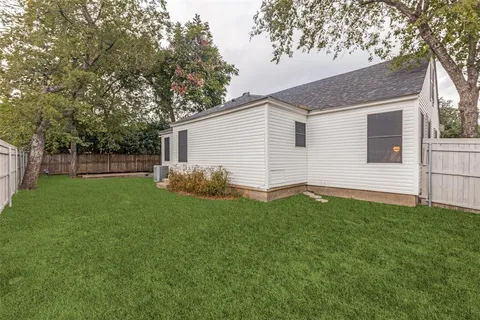 a backyard of a house with lots of green space