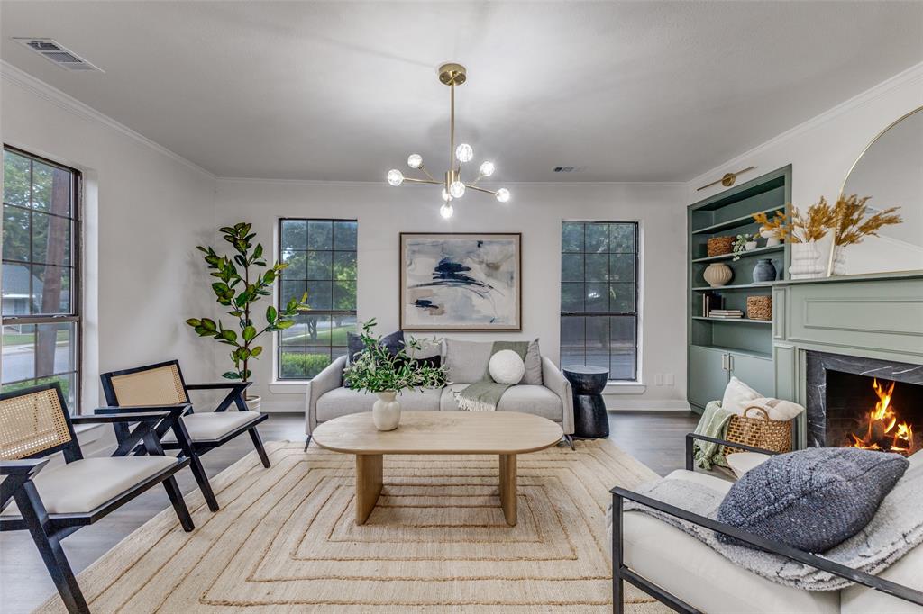 5848 Kenwood Avenue Dallas, TX 75206 - Photo 6 of 32 a living room with furniture and a fireplace
