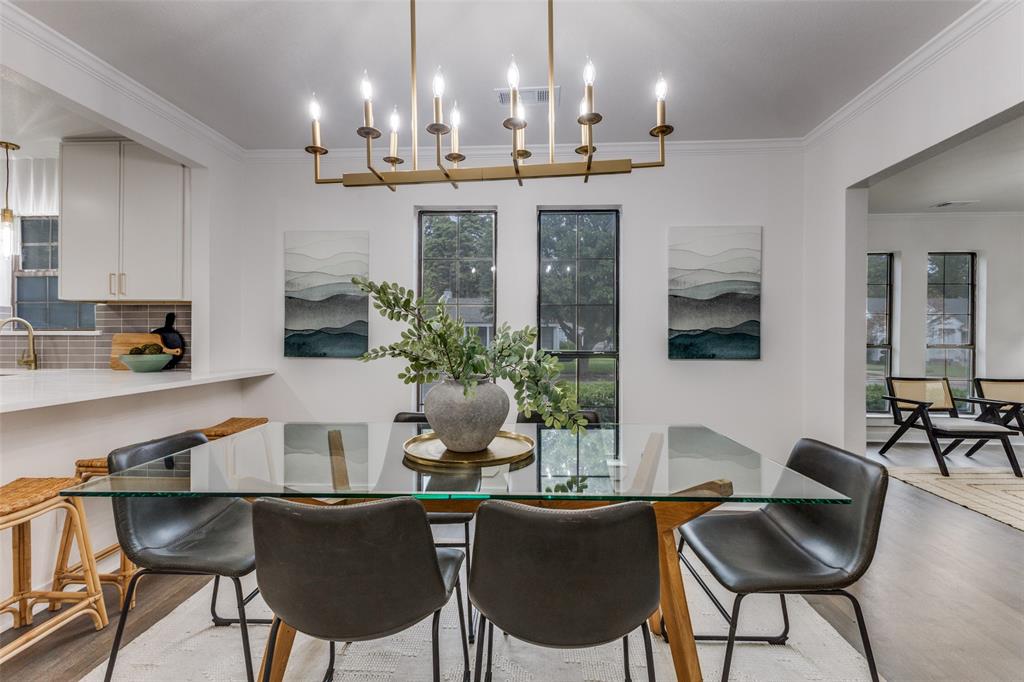 5848 Kenwood Avenue Dallas, TX 75206 - Photo 8 of 32 a dining room with furniture and a chandelier