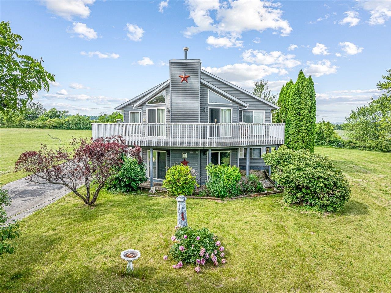 a front view of a house with garden