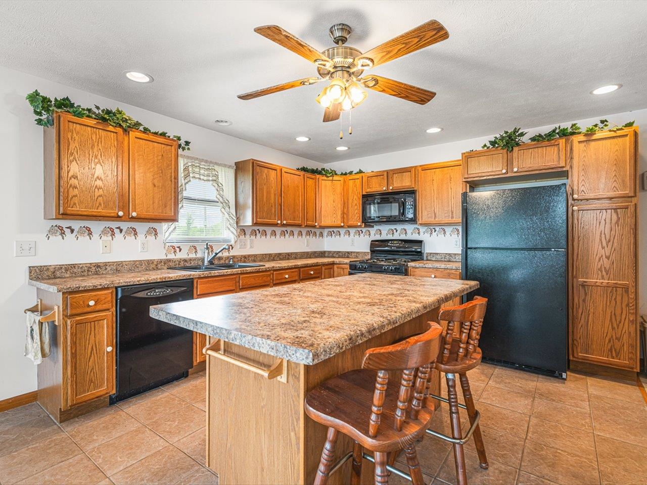 1106 Drexel Road Lake Summerset, IL 61019 - Photo 12 of 43 a kitchen with stainless steel appliances granite countertop a sink a stove and a refrigerator