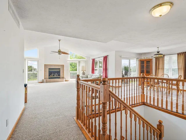 a dining room with furniture a chandelier and a rug