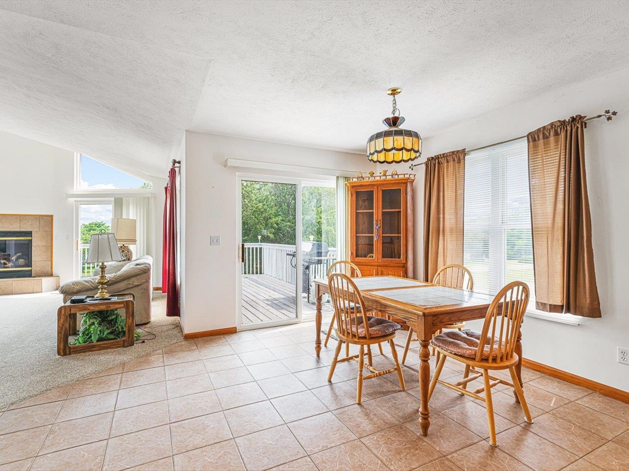 1106 Drexel Road Lake Summerset, IL 61019 - Photo 14 of 43 a dining room with furniture a chandelier and a rug
